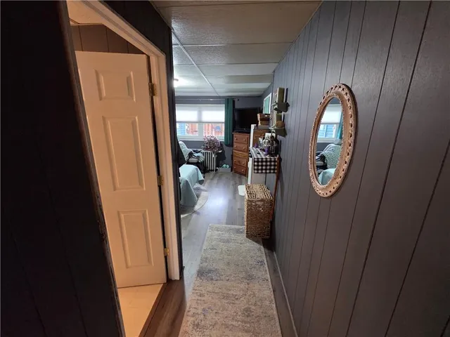 a bed room with furniture and a chair