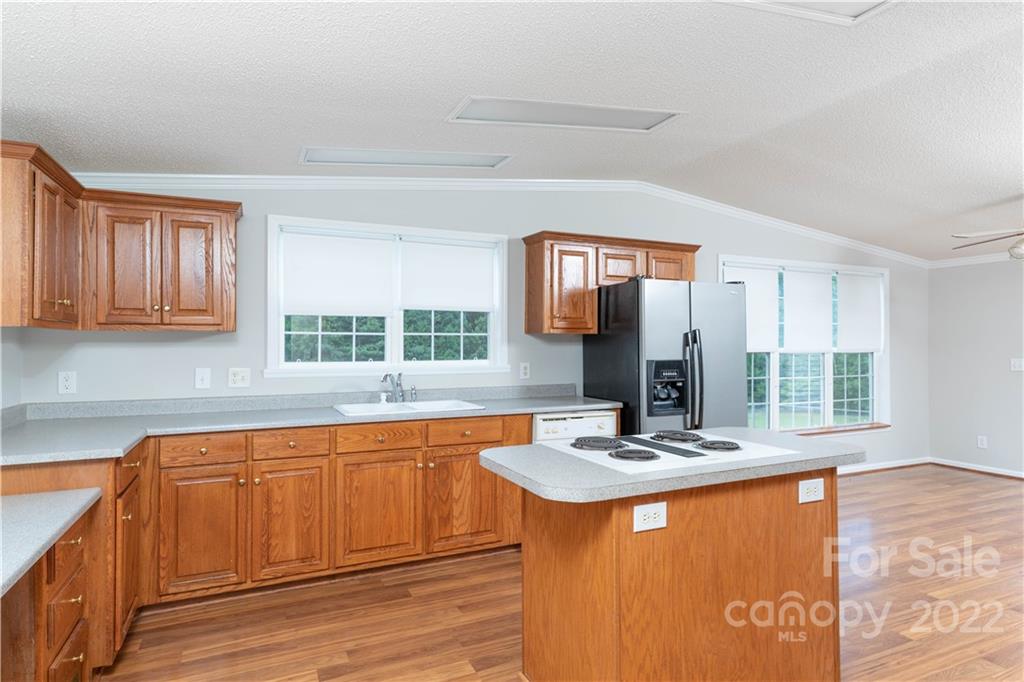 712 Hall Spencer Road Catawba, SC 29704 - Photo 13 of 32 a kitchen with stainless steel appliances granite countertop a sink stove and cabinets