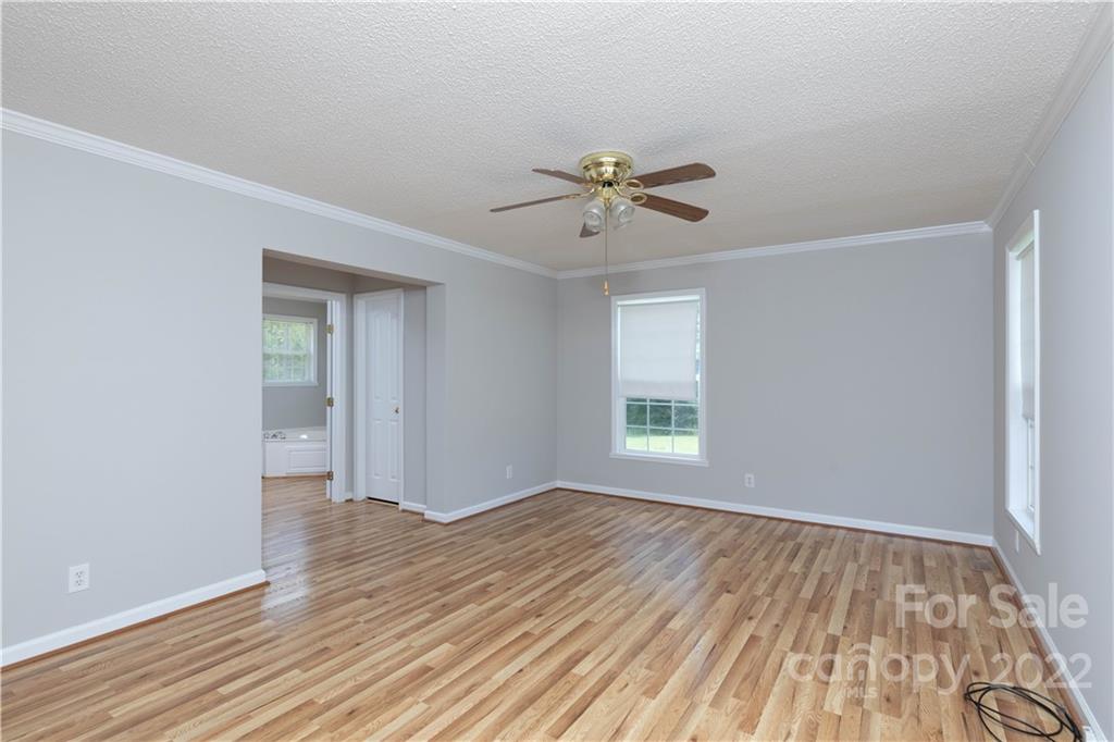 712 Hall Spencer Road Catawba, SC 29704 - Photo 15 of 32 a view of empty room with wooden floor and fan