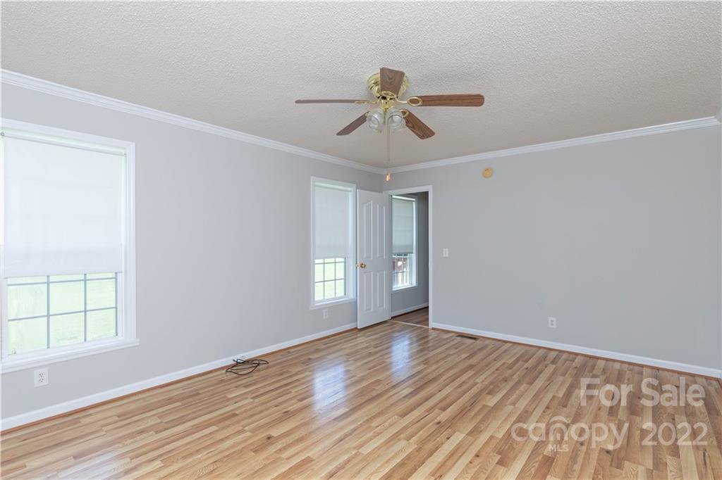 712 Hall Spencer Road Catawba, SC 29704 - Photo 17 of 32 a view of empty room with wooden floor and fan