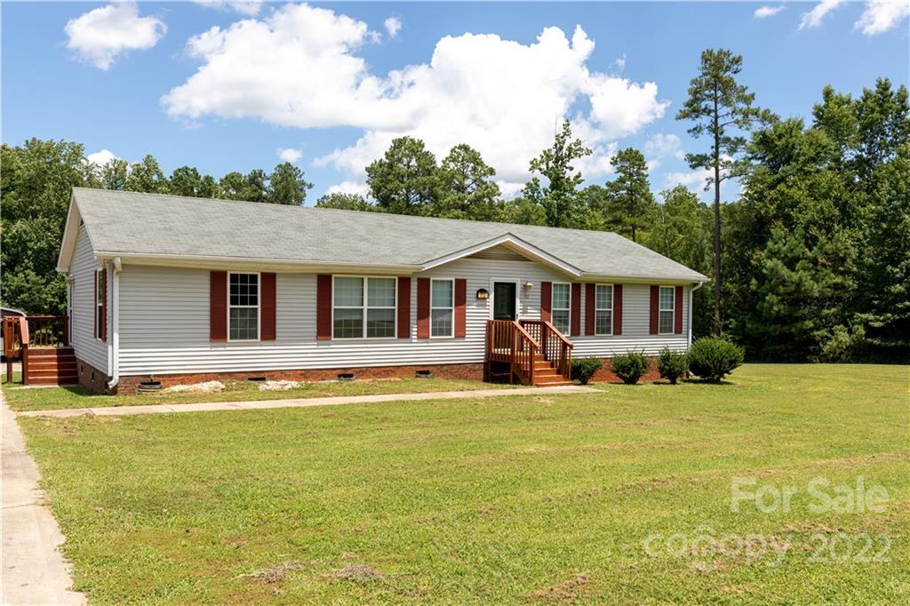 712 Hall Spencer Road Catawba, SC 29704 - Photo 2 of 32 a front view of a house with swimming pool having outdoor seating