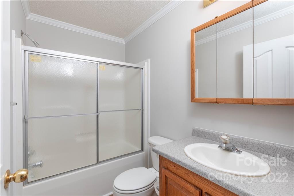 712 Hall Spencer Road Catawba, SC 29704 - Photo 25 of 32 a bathroom with a granite countertop sink toilet and shower