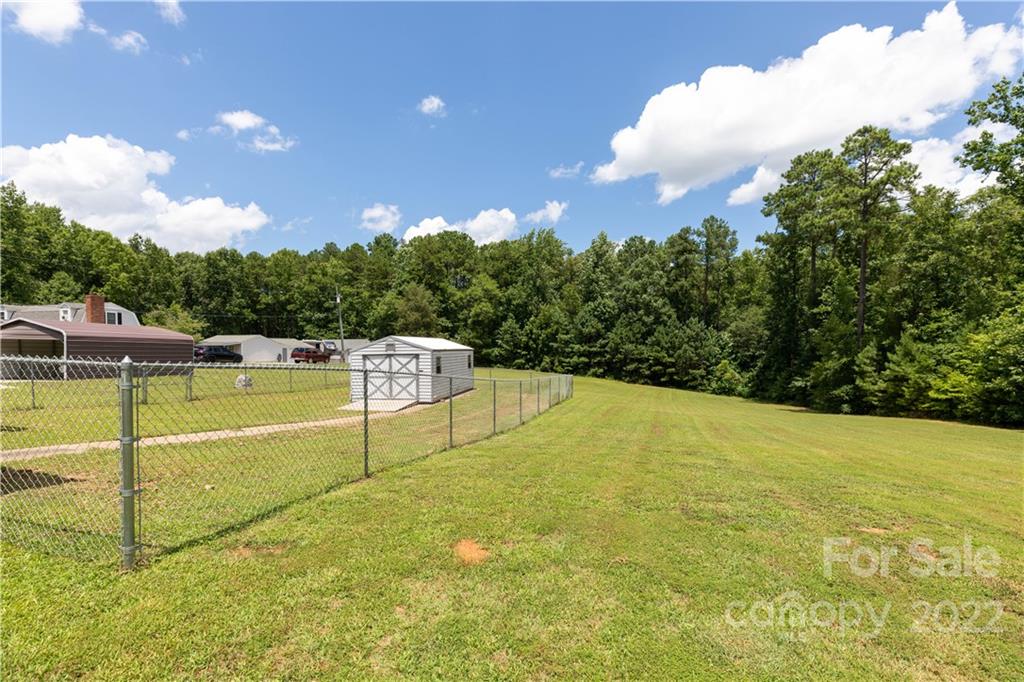 712 Hall Spencer Road Catawba, SC 29704 - Photo 31 of 32 a view of a swimming pool with an outdoor seating and yard