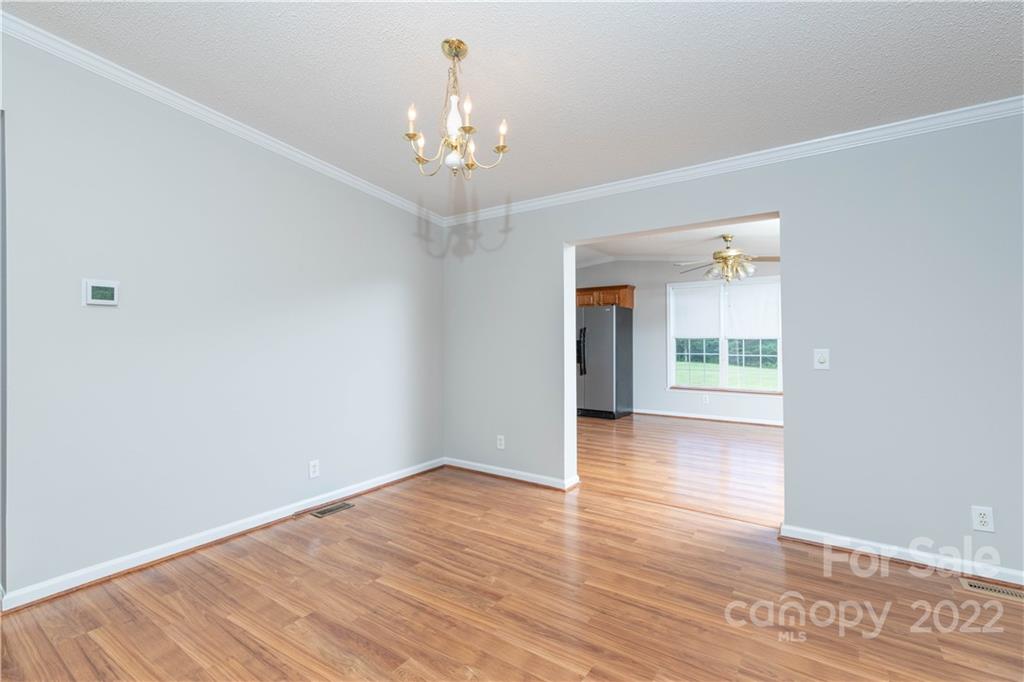712 Hall Spencer Road Catawba, SC 29704 - Photo 8 of 32 wooden floor in an empty room with a window