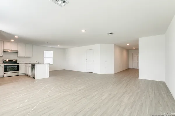 a view of kitchen with wooden floor