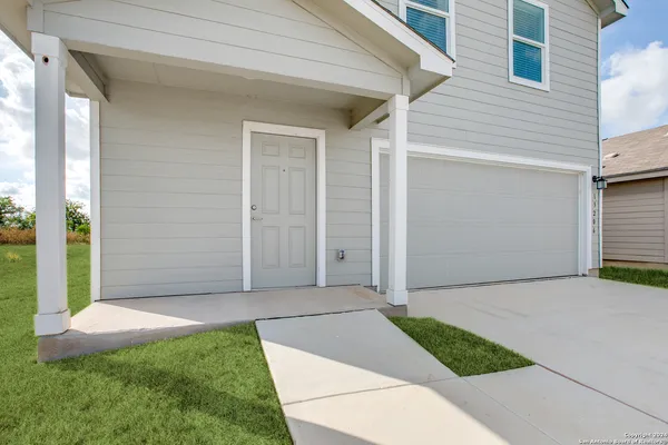 a view of backyard with entryway