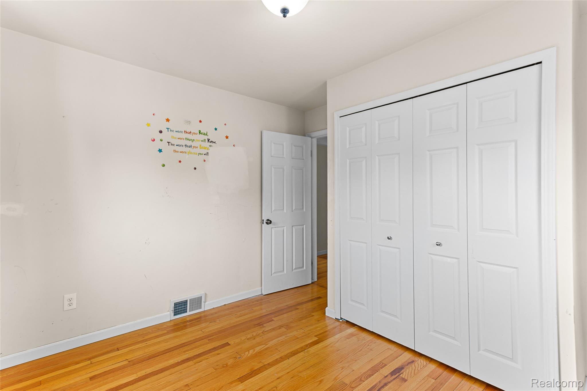 2345 Middlefield Road Trenton, MI 48183 - Photo 16 of 42 Polished wood-finish flooring complements light-toned walls