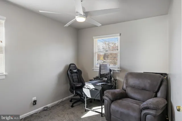 a work room with furniture and a window