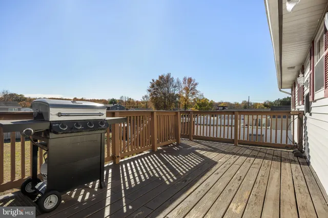 a view of balcony with wooden floor