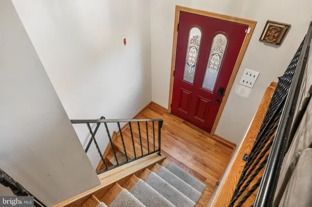 a view of staircase with black and white walls
