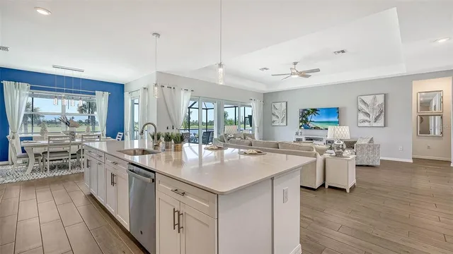 a kitchen with a stove a sink and a cabinets