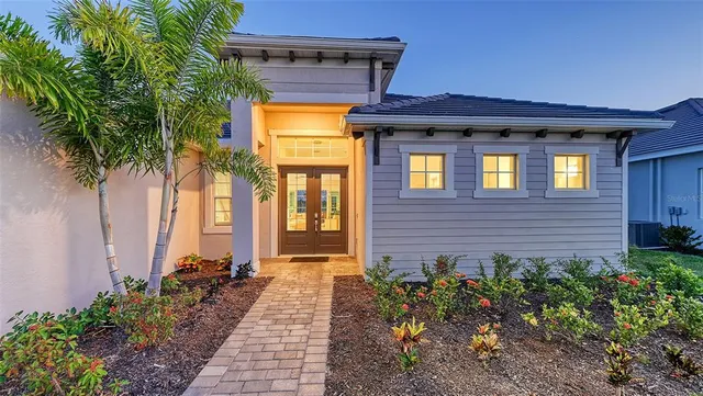 a front view of a house with a glass door