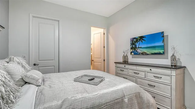 a view of a patio with table and chairs under an umbrella