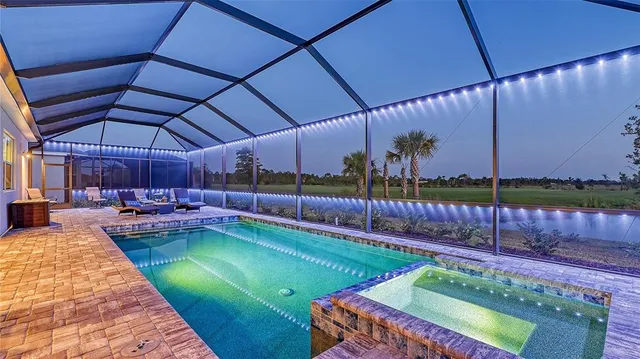 a view of swimming pool with a lounge chair