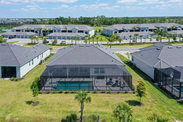a aerial view of a house with garden space and street view
