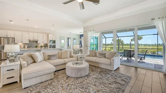 a kitchen with stainless steel appliances granite countertop a stove refrigerator sink and cabinets