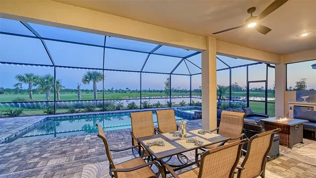 a kitchen with stainless steel appliances a sink a stove and a wooden floors