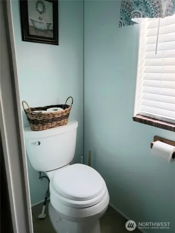 a view of a bathroom from a hallway