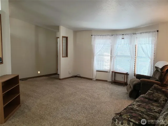 a view of livingroom with furniture and window