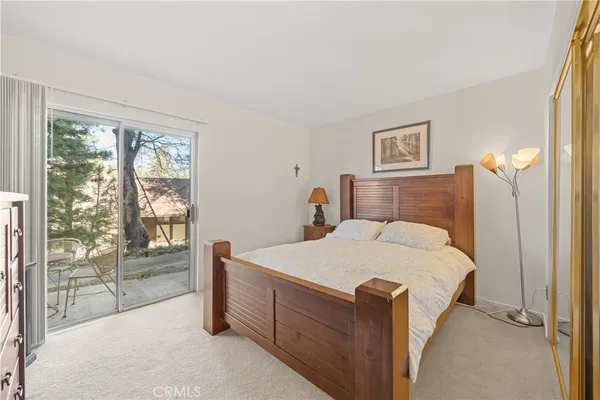 a bed room with a bed and a night stand