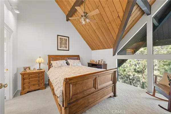 a room with a bed and a large window