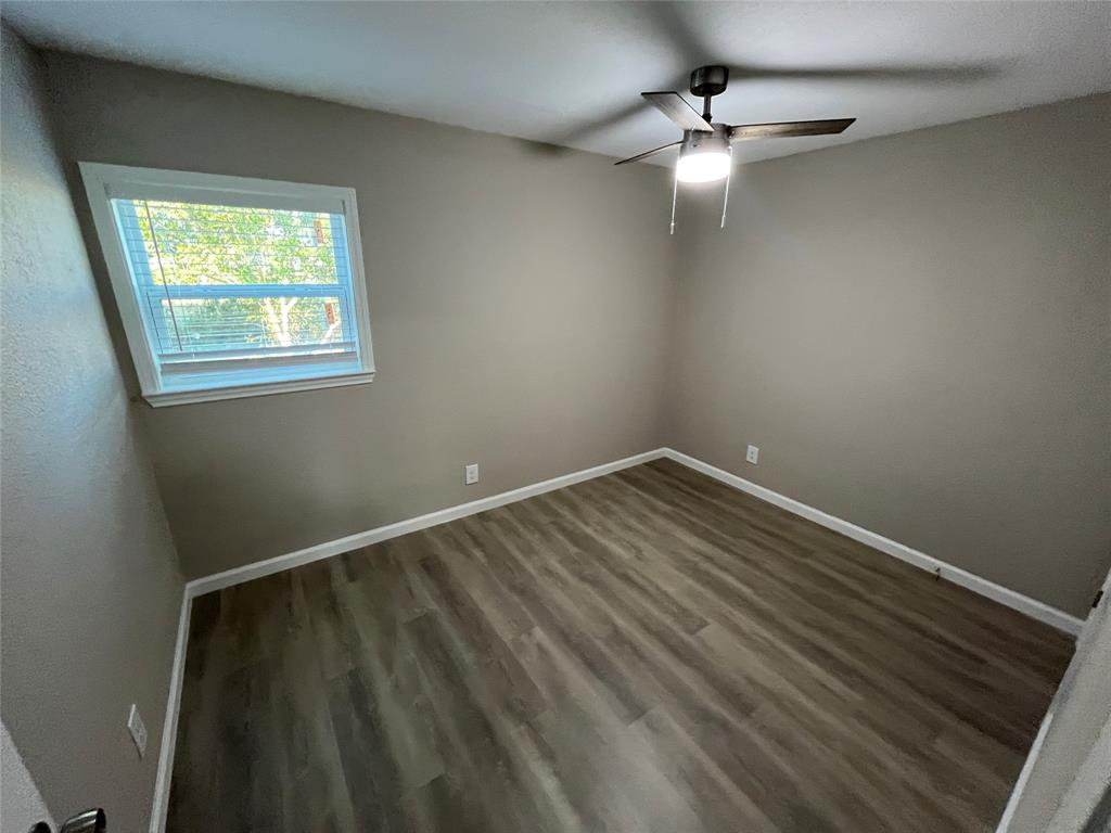 207 Wilmer Heights Drive Wilmer, TX 75172 - Photo 19 of 22 a view of an empty room with a window