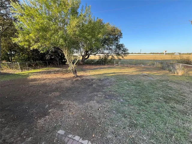 a view of an ocean with a yard