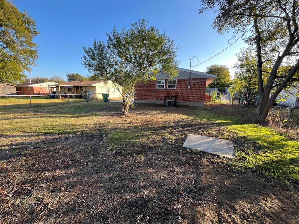 207 Wilmer Heights Drive Wilmer, TX 75172 - Photo 22 of 22 a view of a yard with a house