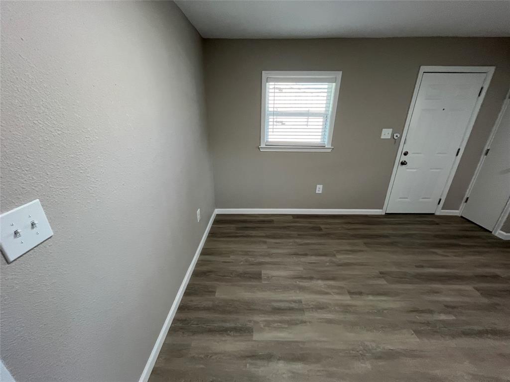 207 Wilmer Heights Drive Wilmer, TX 75172 - Photo 10 of 22 a view of room with window and wooden floor