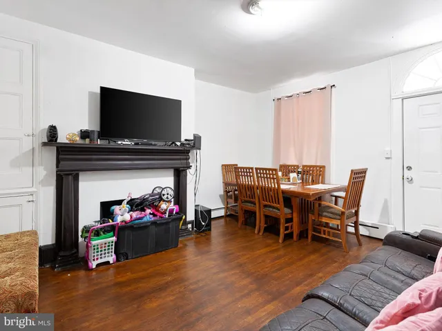 a view of a livingroom with furniture and a fireplace