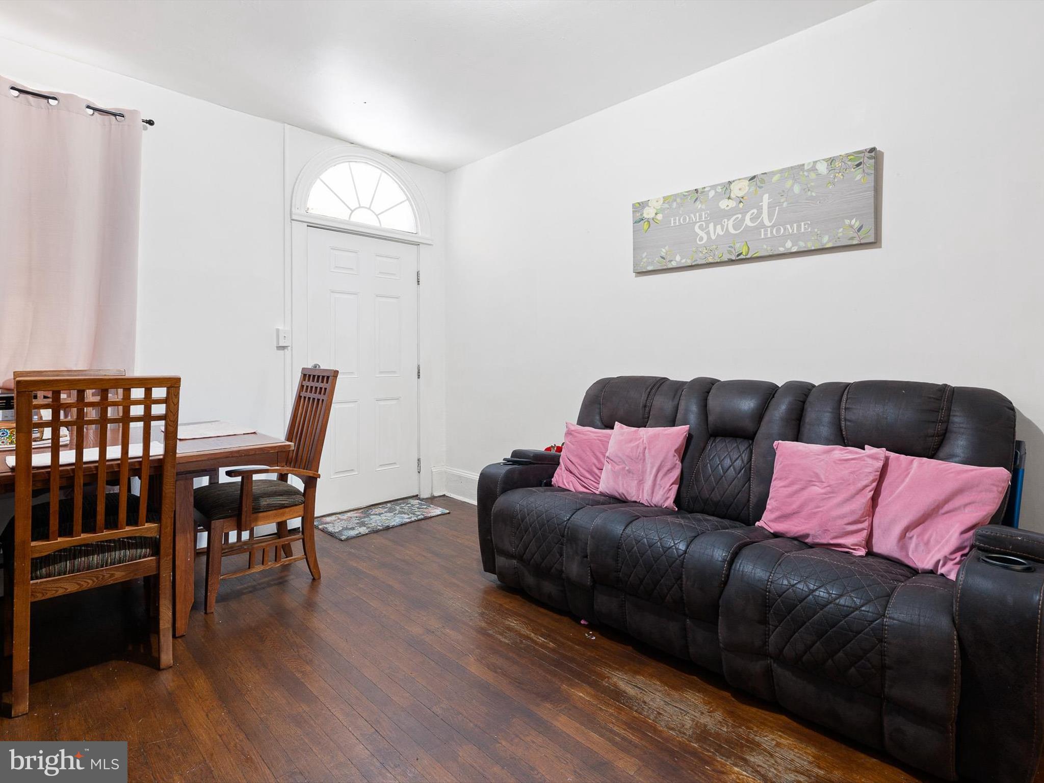 125 West State Street Kennett Square, PA 19348 - Photo 12 of 50 a living room with furniture and a wooden floor