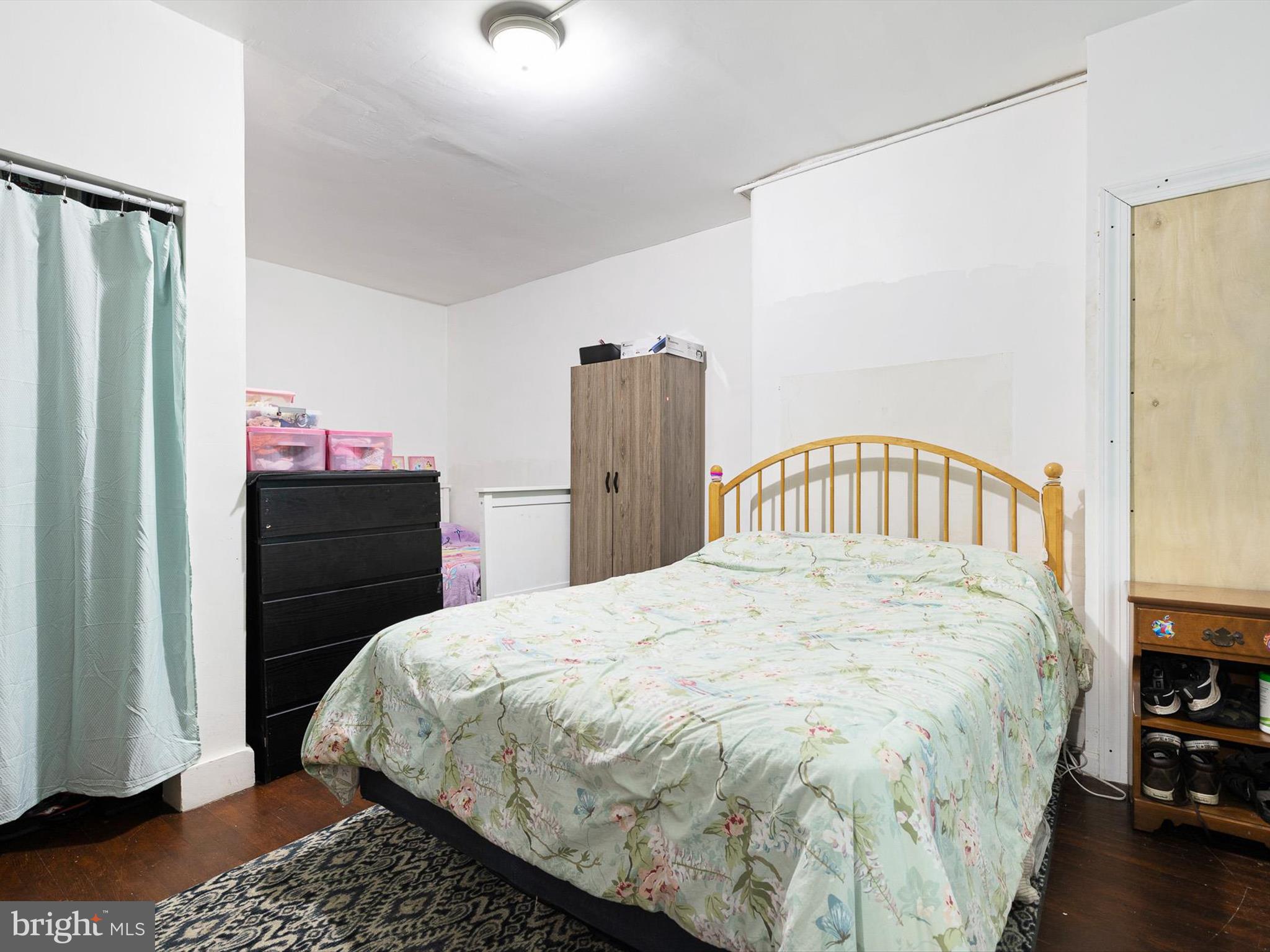 125 West State Street Kennett Square, PA 19348 - Photo 13 of 50 a bedroom with a bed and a dresser