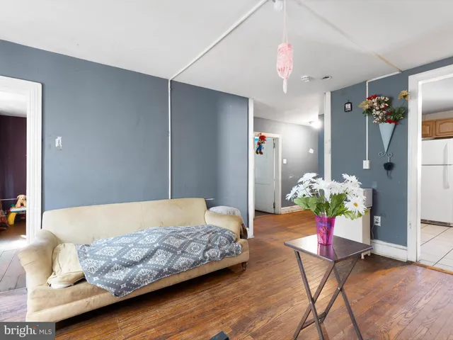 a living room with furniture and flowers