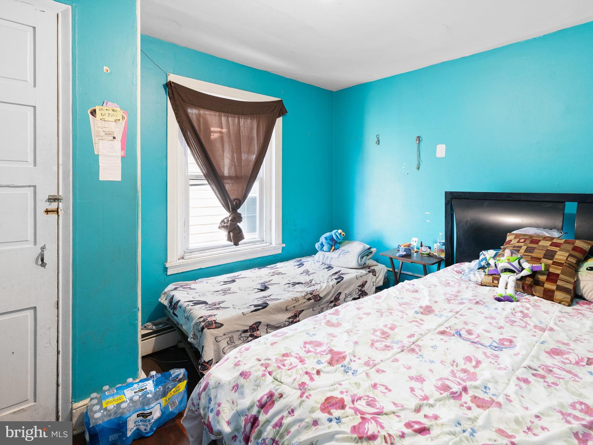 125 West State Street Kennett Square, PA 19348 - Photo 22 of 50 a bedroom with a bed and a window
