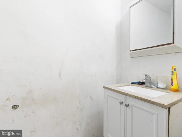 a bathroom with a sink and vanity