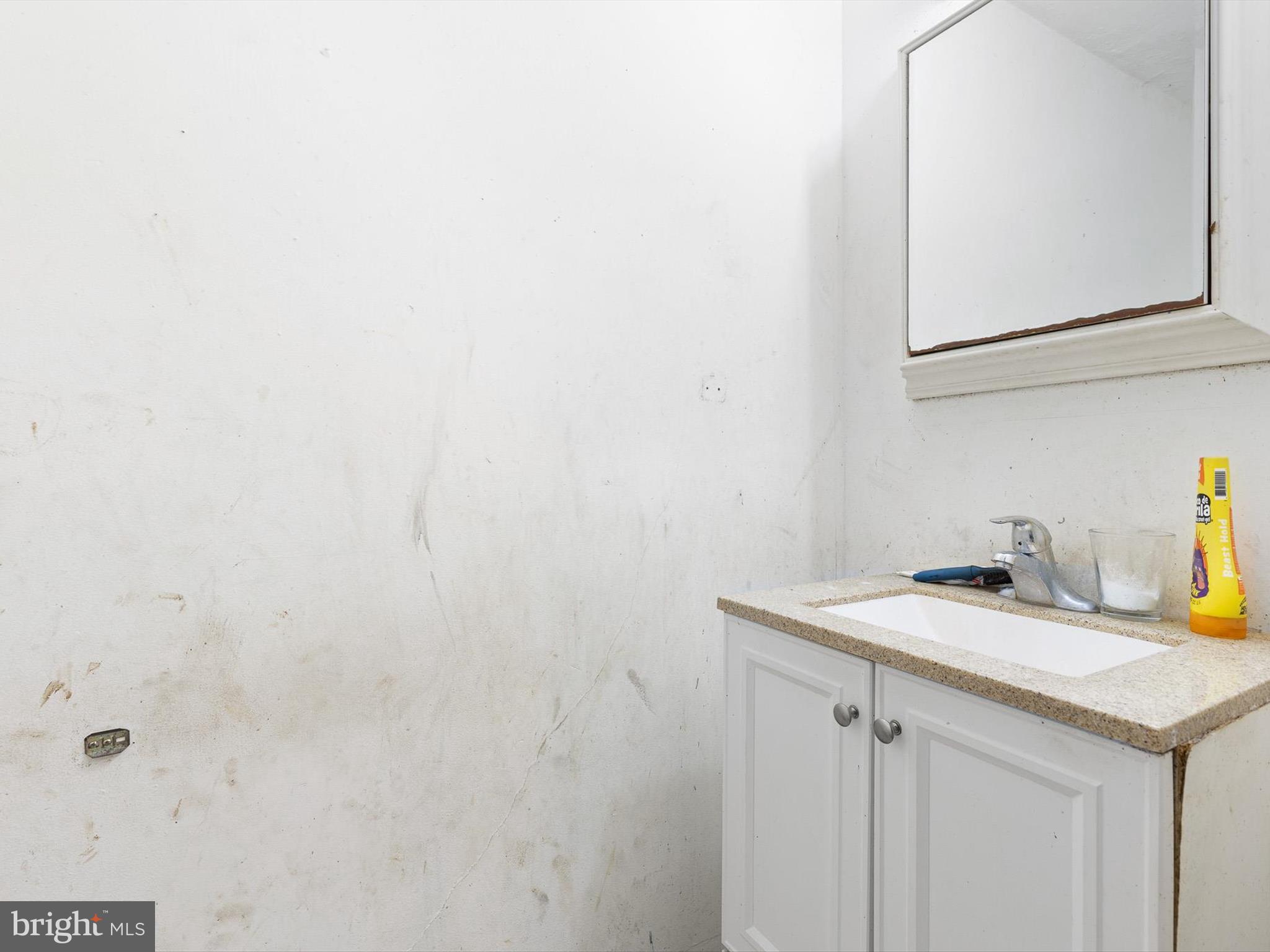 125 West State Street Kennett Square, PA 19348 - Photo 23 of 50 a bathroom with a sink and vanity