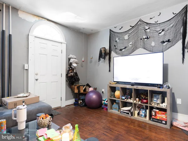 a living room with lots of furniture and a flat screen tv