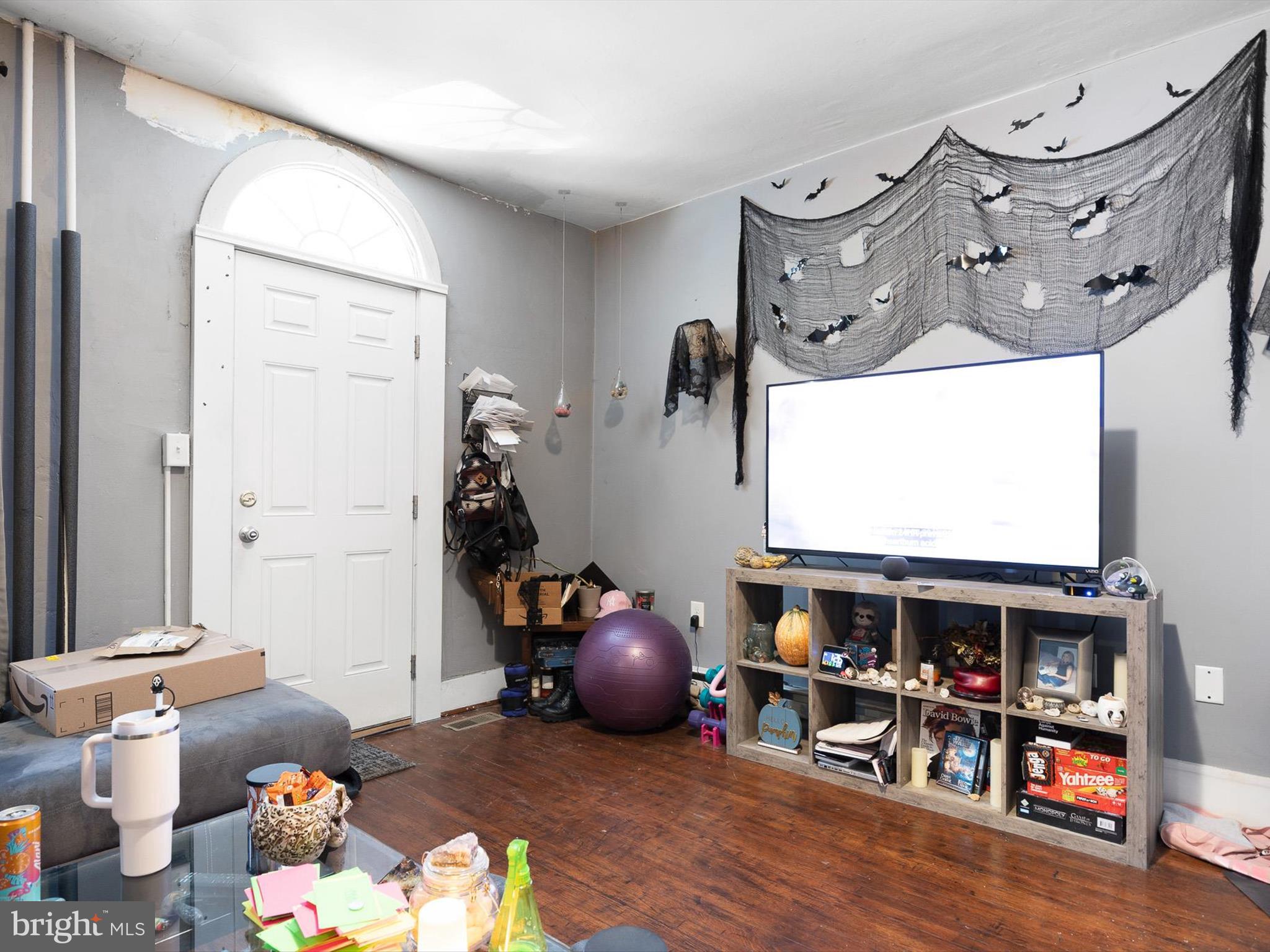 125 West State Street Kennett Square, PA 19348 - Photo 34 of 50 a living room with lots of furniture and a flat screen tv
