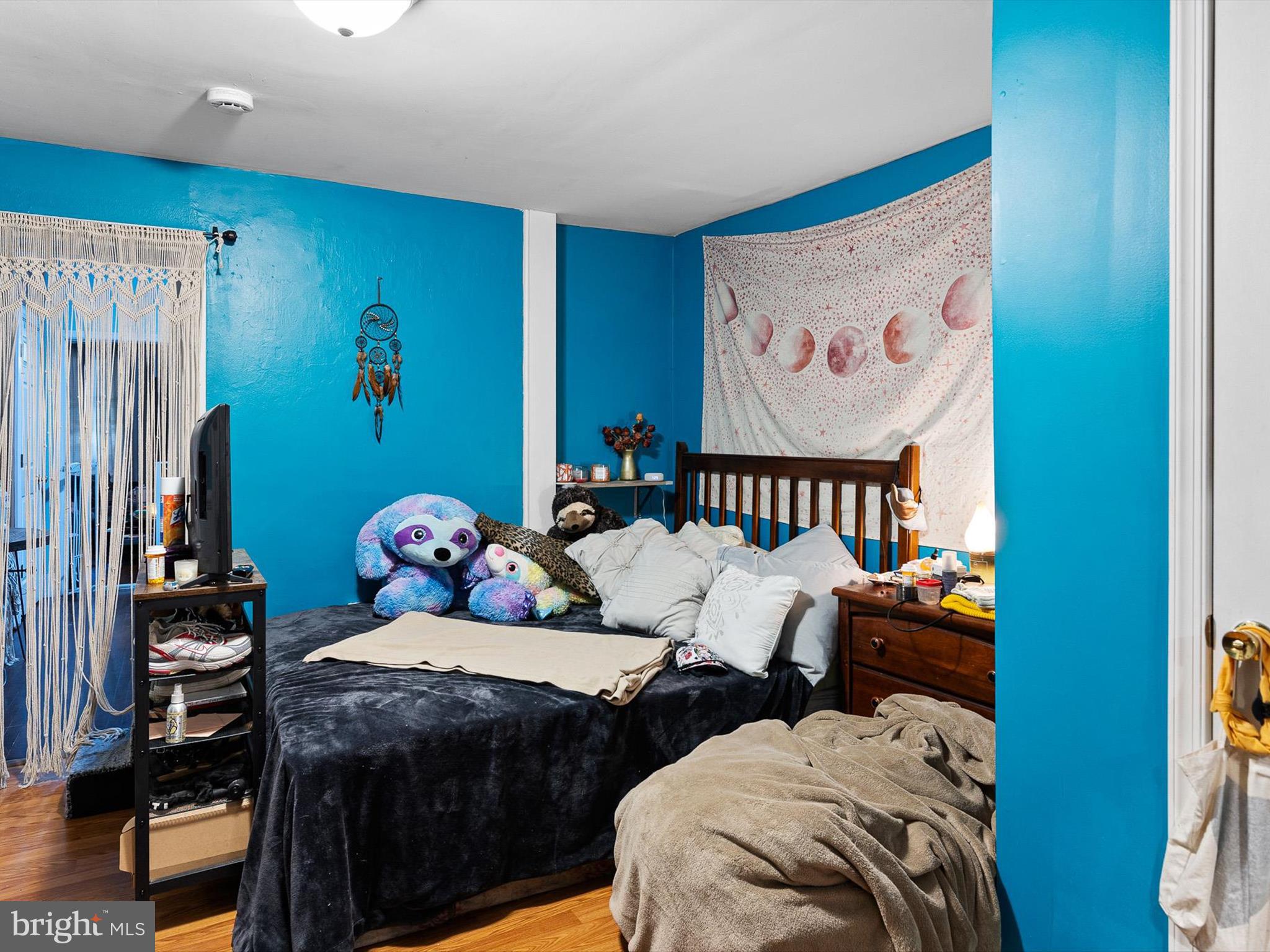 125 West State Street Kennett Square, PA 19348 - Photo 35 of 50 a bedroom with bed and wooden floor