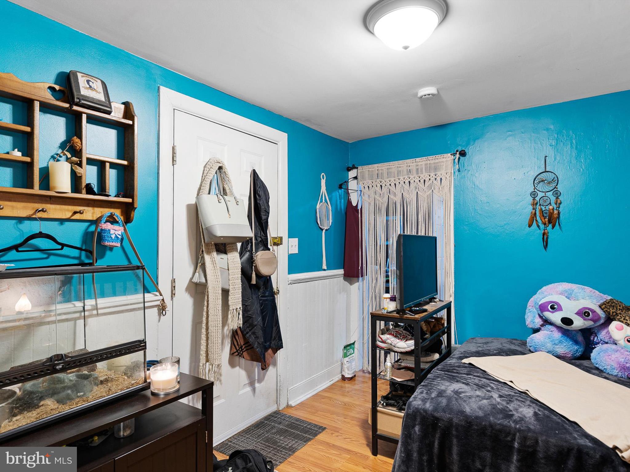 125 West State Street Kennett Square, PA 19348 - Photo 36 of 50 a bedroom with a bed and a tv