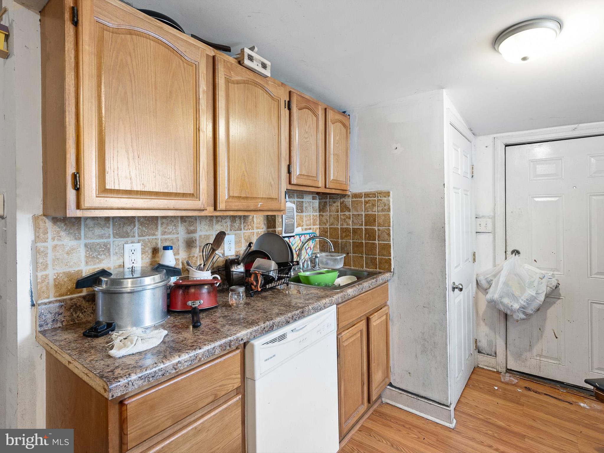 125 West State Street Kennett Square, PA 19348 - Photo 41 of 50 a kitchen with stainless steel appliances granite countertop a sink stove and cabinets