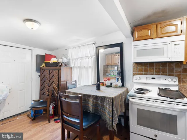 a view of a workspace with furniture and window