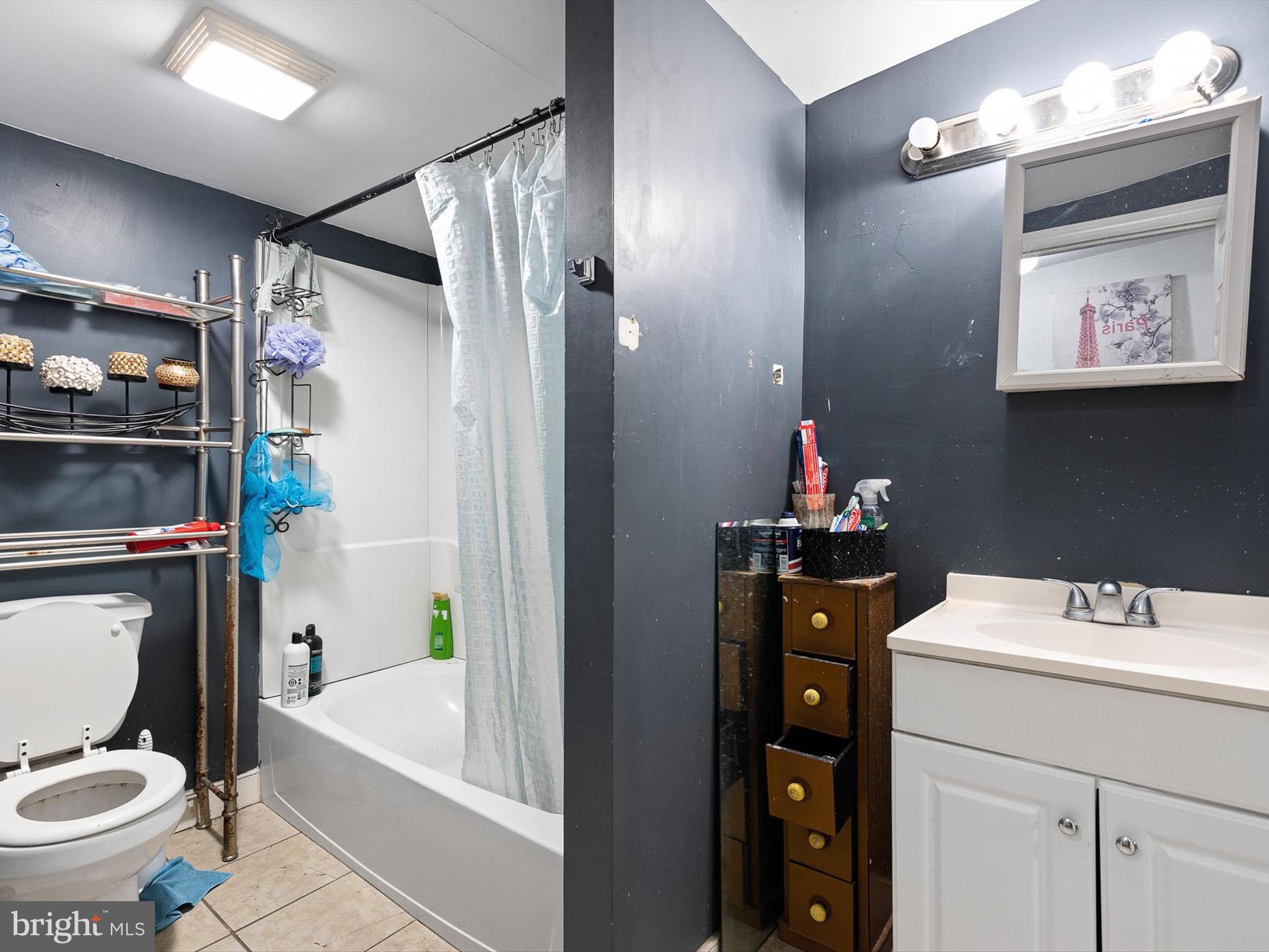 125 West State Street Kennett Square, PA 19348 - Photo 45 of 50 a bathroom with a sink a toilet and shower
