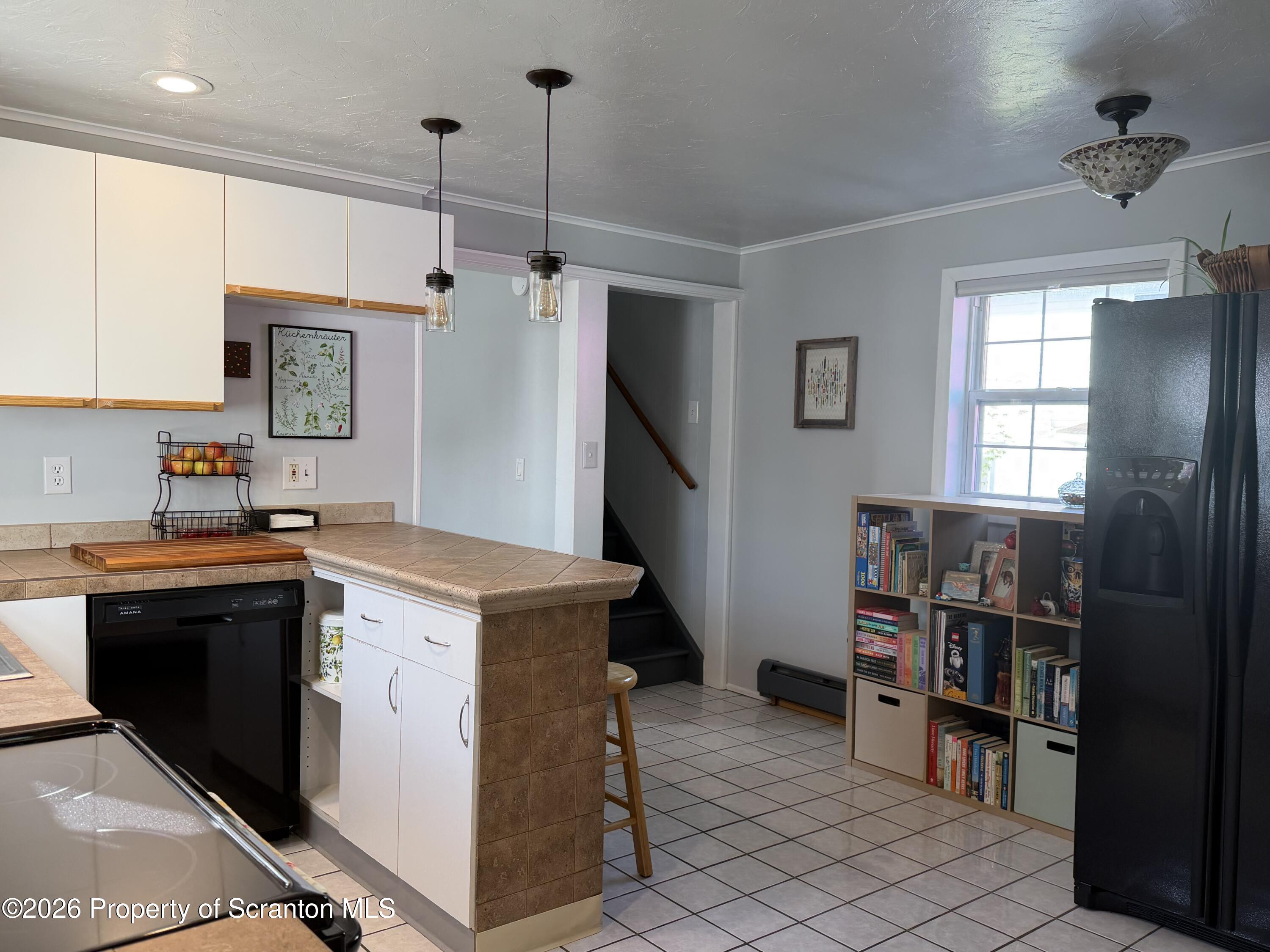 320 Haverly Street Throop, PA 18512 - Photo 7 of 27 a kitchen that has a lot of cabinets in it and kitchen