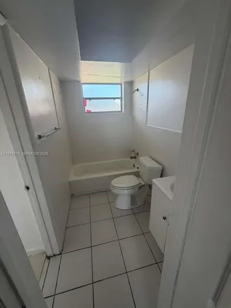 a bathroom with a sink and toilet