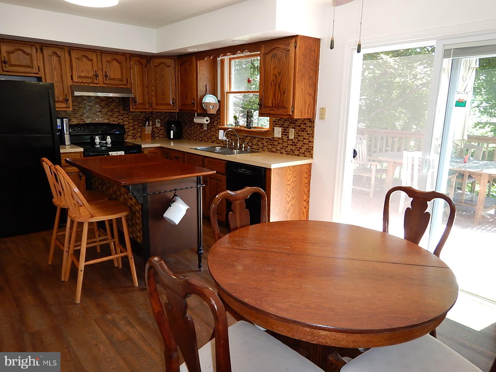708 Edgewood Road Edgewood, MD 21040 - Photo 12 of 39 Table space in kitchen, sliders lead to yard
