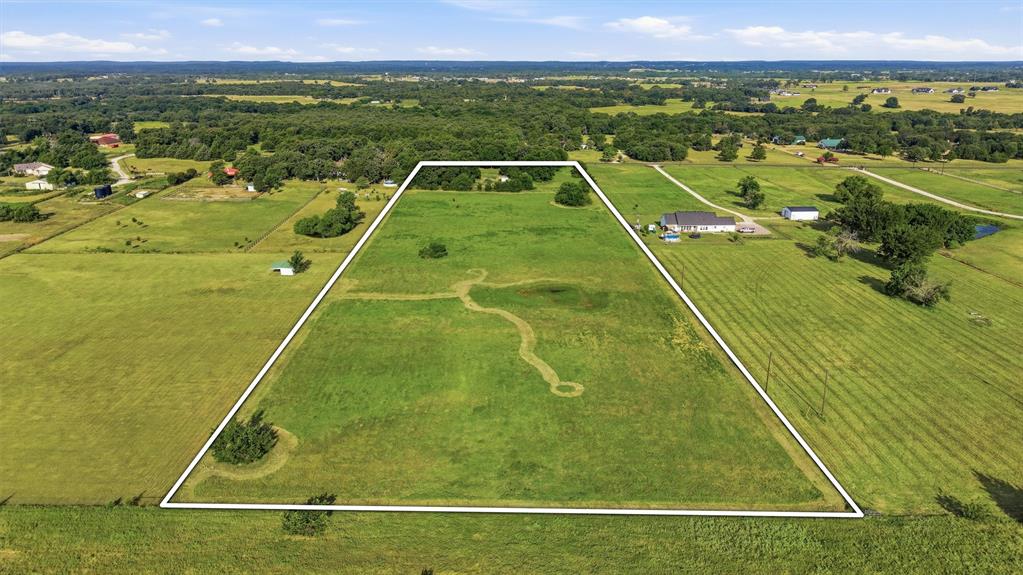 1614 West Line Road Whitesboro, TX 76273 - Photo 3 of 34 Open pasture in the back with a pond