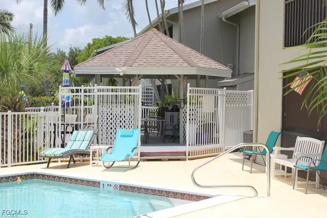 a balcony with table and chairs