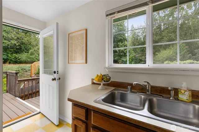 a kitchen that has a sink and a window