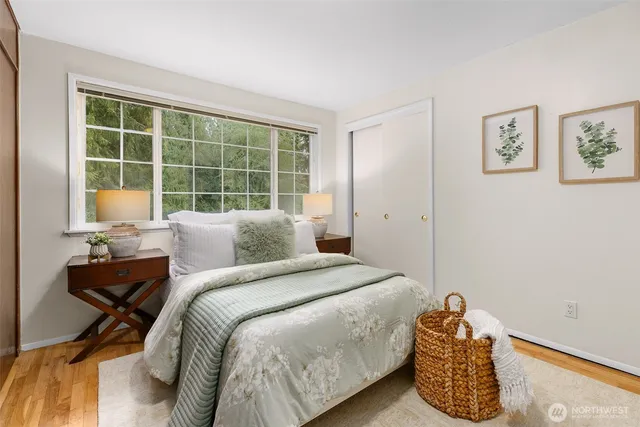 a bedroom with a bed and a window